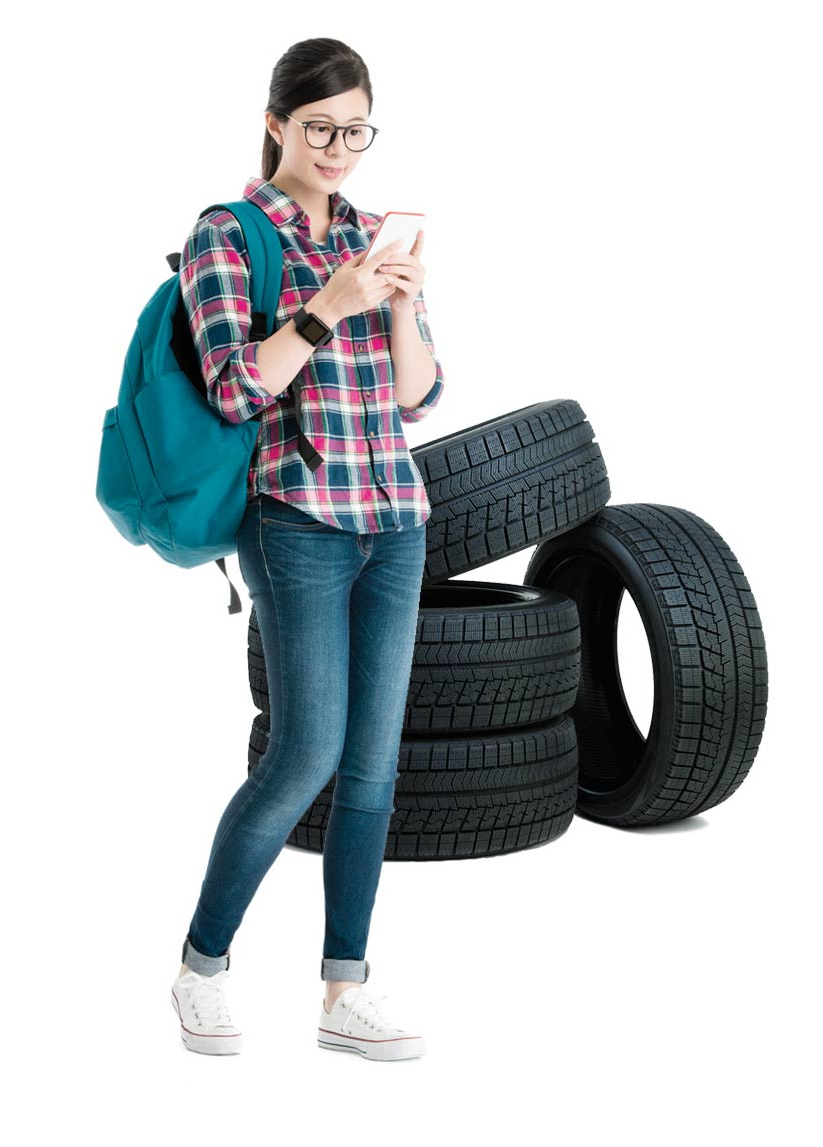 Woman stood next to car tyres